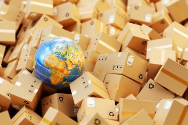 Background with heap of cardboard boxes, parcels and Earth globe
