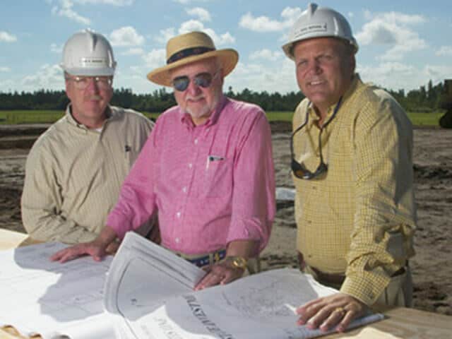 Ruthvens construction site looking at blueprints